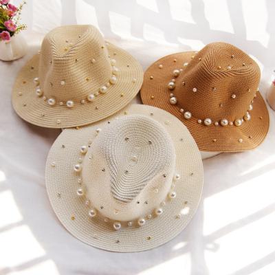 China Fashion Hot Sale Ladies Wide Brimmed Straw Beach Hats Summer Sun Hat Vacation Travel Women Rhinestone Pearl Top Hat for sale