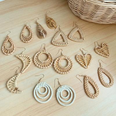 China 2021 CLASSIC fashion rattan earrings earring trend cavity handwoven geometric grass woven ear hook for sale