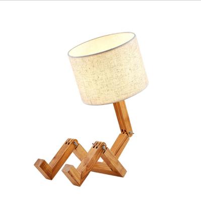 China New Adjustable Folding Reading Light Desk Lamp Solid Wood Robot Night Light Table Study Bedroom Creative Bedside for sale