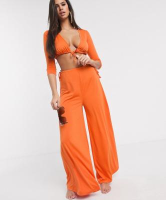 China 2022 Fashion Women Ladies Coordinating Top Stealth Link Beach Crop Front Top And Wide Leg Beach Pants Set for sale