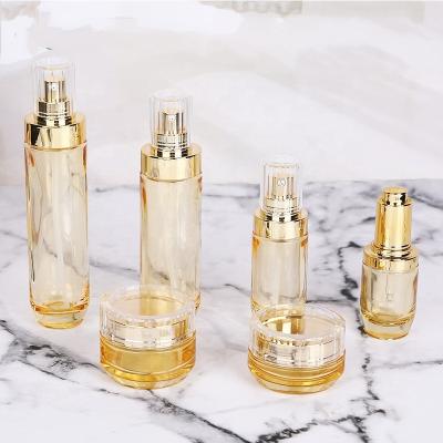 China Luxury 30ML 50ml 100ml Skin Care Bottles Set Empty Yellow Clear Cosmetic Glass Cream Bottle Jar Lotion Bottle Cosmetic Packaging for sale