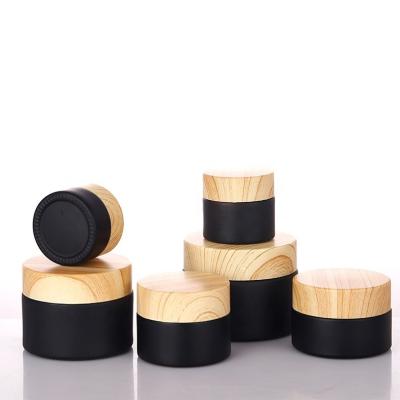 China Skin Care 5ML 10ML 30ML Matte Black Glass Jar Cream Set Lid Skin Care Bottle Face Cream Packaging Bamboo Jars 30g 50g 100g for sale