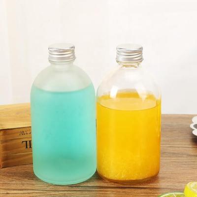 China Food Grade Boston Round Bottle 270ML 350ML Cosmetic Clear Glass Reusable Glass Bottles For Juice Glass Juice Bottles 16oz for sale