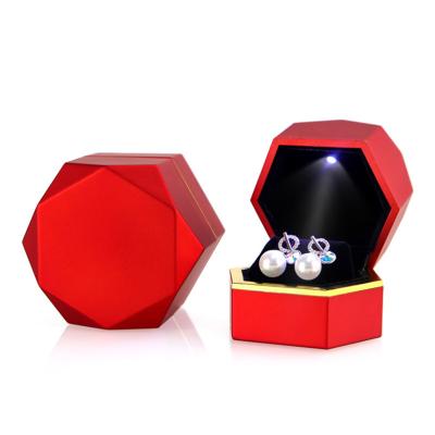 China Red jewelry package Hanhong factory supply engagement ring box direct hexagonal custom logo latest LED jewelry box with led light for sale