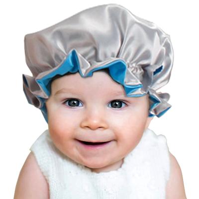 China Low MOQ Adjustable Custom Made Hoods And Wraps Silk Logo Baby Hair Satin Children Hair Sleep Hat for sale