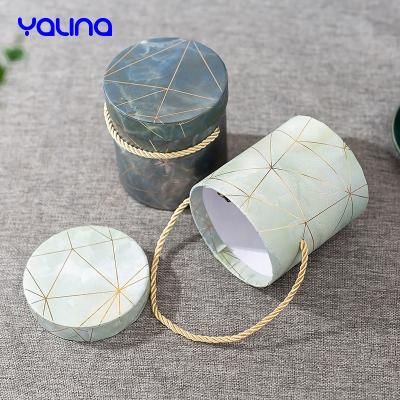 China Luxury Recycled Materials Gold Foil Logo Lift Up Empty Box With Handles For Skin Care Clothing Candle Packaging Boxes for sale