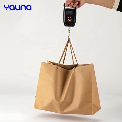 China Brown Recycled Materials Boutique Kraft Paper Take Away Biodegradable Reusable Packaging Bag For Clothes Food Wigs Packing Gift Paper Bag for sale