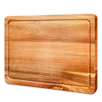 China Sustainable High Quality Rectangular Craft Cutting Board Acacia Wood Cutting Board With Groove And Built In Handles for sale