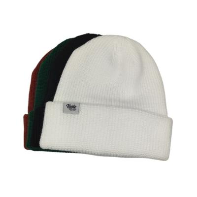 China Custom Unisex Warm 100% Acrylic Embroidery COMMON Beanie Knitted Hat for sale