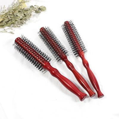 China All Wholesale Nylon Teeth Lotus Wood Loop Comb Salon Styling Hair Comb for sale