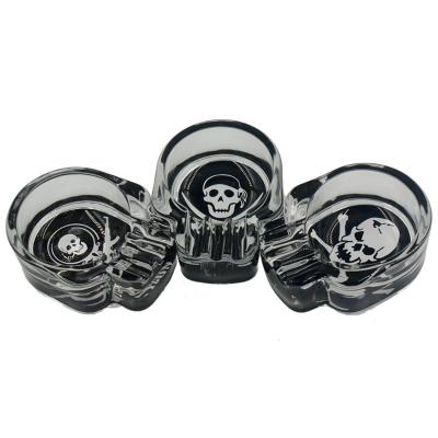 China Smoking Accessories Wholesale Smoking Cigarette Ash Holder Jamaica Transparent Black Mini Glass Skull Ashtray Accessories for sale