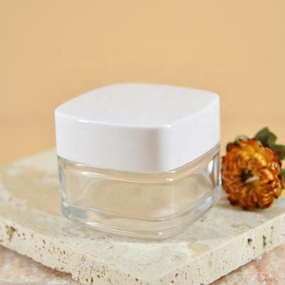 China Eco-friendly Clear Square Tapas Jars 50ml Frascos de vidrio Glass Cream Jar for Cosmetic Cream for sale