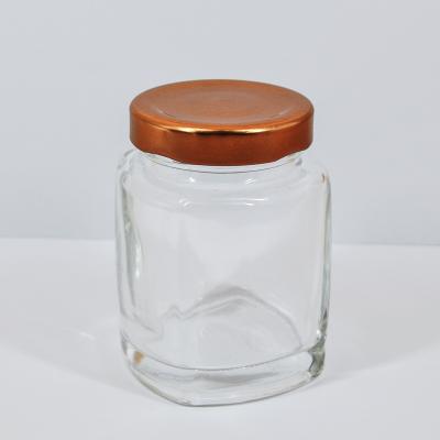 China Eco-friendly Recyclable Cheap Square Glass Honey Jars 180ml 280ml 380ml Glass Jars With Metal Lids for sale