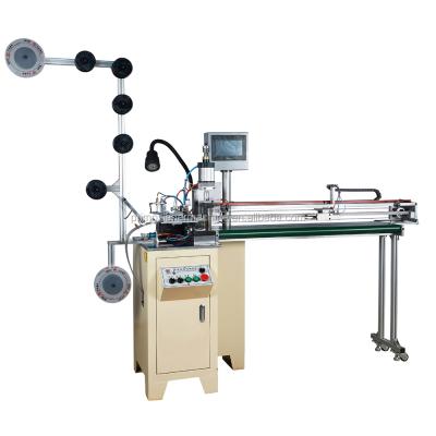 China Automatic Metal Zipper Metal Zipper Cutting Machine wirh Robot Open Arm for sale