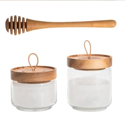 China Wooden Glass Honey Container Bottle Lid Pot 250ml 450ml Eco-Friendly Reusable Kitchen Freshness Unique Storage With Wooden Dipper for sale