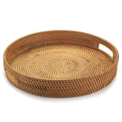 China Retro Style Home Decor Round Eco-friendly Natural Food Sustainable Brown Wicker Rattan Tray With Rattan Handle for sale