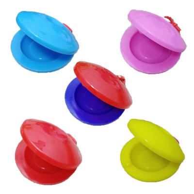 China Plastic Children's Percussion Instrument Finger Castanets Round Dance Board Educational Musical Instrument Children's Castanets for sale