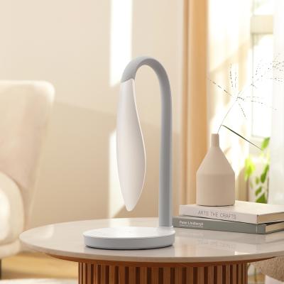 China Hot Selling Rotating 3 Lights AA Table Lamp With Wireless Charger 360' Rotating Touch Eye Silicone Rubber LED Protector for sale