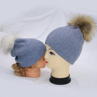 China COMMON matching mum and baby beanies double layer winter hats set with raccoon fur pom pom for sale