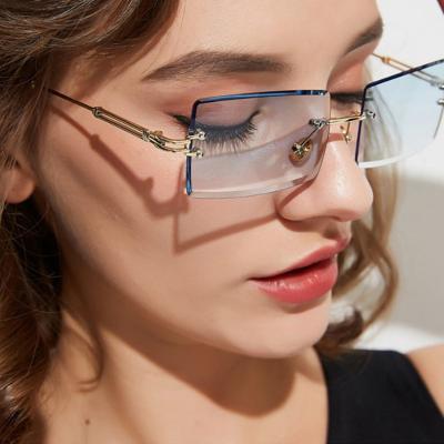 China New Rectangle Sunglasses Fashion Sun Glass Hot Sale Men Frameless Trendy Small Size Ocean Glass Metal Rimless Sunglasses Women for sale