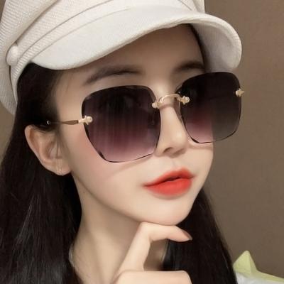 China Newcomers Rimless Ocean Glasses UV400 Sun Colored Glasses Fashion Wave Frame Sunglasses SKYWAY Sunglasses for sale