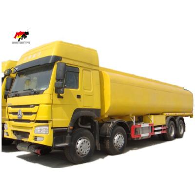 China sinotruk 8*4 howo 8*4 oil delivery vacuum tanker truck 371hp 30cbm gasoline oil tanker diesel fuel tank truck with low price 11 - 20T for sale