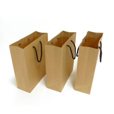 China Factory Wholesale Recyclable Paper Kraft Paper Bags Cost Effective Flat Handle for sale