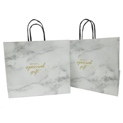 China Customized Recyclable LOGO Art Paper White Marble Gift Shopping Bag White Paper Bag With Handle for sale