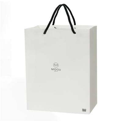 China Recyclable Many Gift Bag Stocking White Floral Fashion Bag Simple Paper Bag With Rope for sale