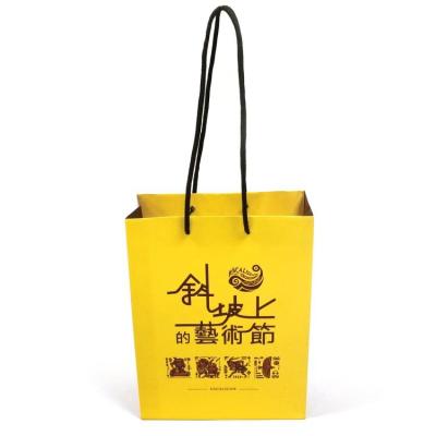 China Doorgift handmade pasting glossy paper bag for sale