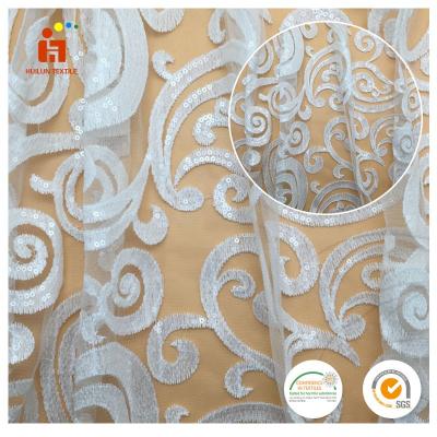 China SHAOXING TEXTILE Viable white cheap embroidery bridal stretch beaded lace fabric with full sequins for sale