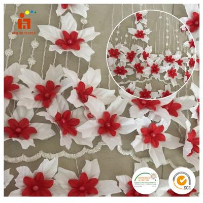 China China factory stock polyester 3D anti-static flower beaded net lace fabric for dress for sale