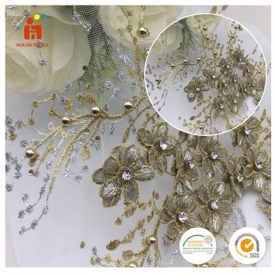 China Good Quality Anti-static Heavy Flower Shaoxing Tulle Fabric Gold Floral Green Beaded Embroidered Fabric For Dress for sale