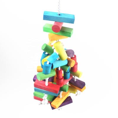 China Viable Natural Large Wooden Blocks Bird Chewing Toy Pets Gnawing Chewing Bite Cage Toy For Medium Small Bird Parrot for sale