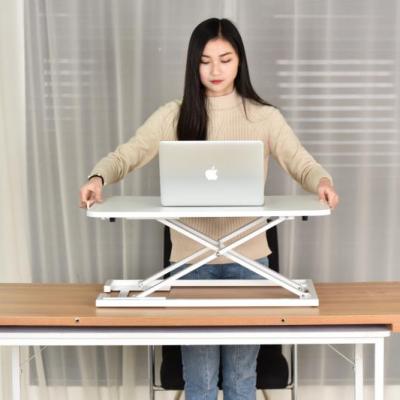 China (Height) adjustable standing desk converter with adjustable height, gas spring riser sit to stand table workstation for sale