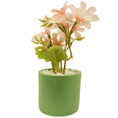 China PE Artificial flowers in concrete pot modern home decor Faux potted Greenery for sale