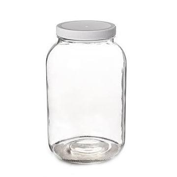 China Medium Size Canned Food Candy Glass Jar With Metal Lids for sale