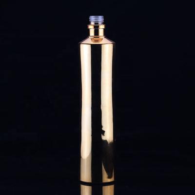 China High End Glass Colored Vodka Bottle 750ml Vodka Liquor Bottle With Gold Color for sale