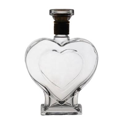 China Wholesale Liquor Bottle 500ml Liquor Bottle 750ml Heart Shaped Glass Bottle With Cork for sale