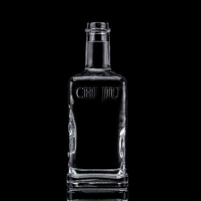 China Beverage Trending Square Shaped Engraving Design 750ml Clear Glass Vodka Liquor Bottle With Cork Lid for sale