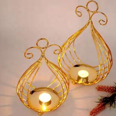 China Nordic creative home decoration candle holder plated candlestick gold ornaments wedding iron props for sale