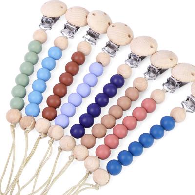 China BPA Free LFGB Approved BPA Free Wholesale Dummy Pacifier Holder Cases Wooden Silicone Baby Pacifier Clip for sale