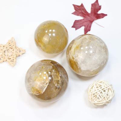 China China in Gold Crystal Ball Real Natural Quartz Sphere Healer Quartz Balls Customized by Stock Decoration for sale