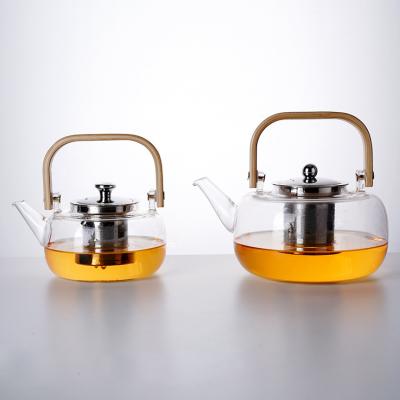 China Excellent Sustainable Housewares 600ml/800ml/1000ml High Borosilicate Handmade Thickened Glass Teapot With Infuser for sale