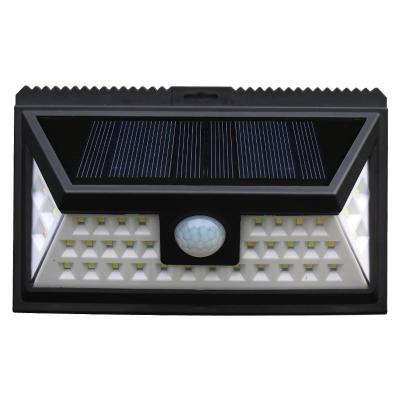 China Jiexuan 36led Garden Lighting System Solar Home Products Wall Lamp Motion Sensor Bright Outdoor Solar Powered Smart Lights for sale