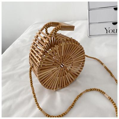 China High quality new arrival personality woven hollow mobile phone purse large capacity round bamboo evening clutch bag for ladies for sale