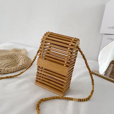 China High quality 2021 summers retro personality new woven mobile phone hollow bag bamboo evening clutch for ladies for sale