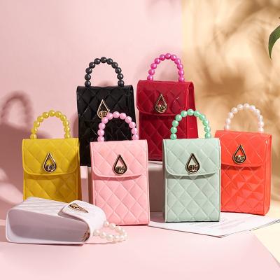 China The New Luxury Cell Phone Jelly Handbags Small Pearl Rhombus Clip Style PVC Mini Shoulder Bag For Girls Lock for sale