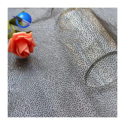 China Polyester Mesh Fabric Roll Dot Foil Finishing Tulle Dress Anti-Static 100% Polyester Knitting Transparent Shiny Dyeing Solid Fabric Knitted for sale