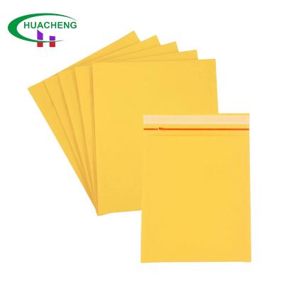 China Cosmetics Kraft Paper Envelope Bubble Mailer Bags Padded Envelopes Custom Yellow Self-adhesion Good Cushioned Kraft Paper Bags With Logos Custom for sale